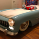 Illustration for article titled GM Clay Sculptor Buys The Shittiest Car In The Junkyard And Turns It Into His Son's Bed